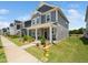 Inviting two-story home boasts a covered porch, manicured lawn, and fresh landscaping at 1981 Rosedale Ridge Ave, Wake Forest, NC 27587