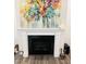 Close-up of a fireplace with a mantel and decorative artwork with dark accents at 1981 Rosedale Ridge Ave, Wake Forest, NC 27587
