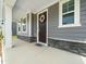 Welcoming front porch with stone accents, a decorative wreath, and ample space at 1981 Rosedale Ridge Ave, Wake Forest, NC 27587
