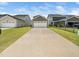This home has a detached two-car garage with a long driveway and well-manicured lawn at 1981 Rosedale Ridge Ave, Wake Forest, NC 27587