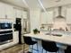 Spacious kitchen with white cabinets, quartz countertops, and stainless steel appliances at 1981 Rosedale Ridge Ave, Wake Forest, NC 27587