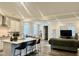 Open-concept kitchen and living area with a center island, stainless steel appliances, and natural light at 1981 Rosedale Ridge Ave, Wake Forest, NC 27587