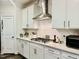 Well-equipped kitchen with stainless steel appliances, white cabinets, and ample counter space at 1981 Rosedale Ridge Ave, Wake Forest, NC 27587