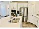 Kitchen with stainless steel sink, quartz countertops, and modern appliances at 1981 Rosedale Ridge Ave, Wake Forest, NC 27587