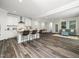 Open floor plan featuring a bright living room and a spacious kitchen with island seating at 1981 Rosedale Ridge Ave, Wake Forest, NC 27587