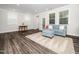 Spacious living room area with accent rug, seating area, and access to dining area at 1981 Rosedale Ridge Ave, Wake Forest, NC 27587