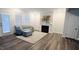 Cozy living room with a fireplace, modern furniture, and a door with a window at 1981 Rosedale Ridge Ave, Wake Forest, NC 27587