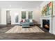 Inviting living room space features a fireplace, plush rug and comfortable seating at 1981 Rosedale Ridge Ave, Wake Forest, NC 27587