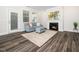 Comfortable living room features a cozy fireplace, natural light, and modern decor at 1981 Rosedale Ridge Ave, Wake Forest, NC 27587