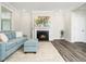 This living room features a fireplace, painting, natural light, and modern decor at 1981 Rosedale Ridge Ave, Wake Forest, NC 27587