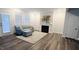 Cozy living room featuring a sofa, fireplace, and a large, colorful painting at 1981 Rosedale Ridge Ave, Wake Forest, NC 27587