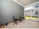 Screened-in patio featuring two wrought iron chairs and a small table at 1981 Rosedale Ridge Ave, Wake Forest, NC 27587