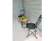 Inviting porch with decorative black metal chairs and wood table perfect for outdoor seating at 1981 Rosedale Ridge Ave, Wake Forest, NC 27587