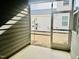 A screened porch with siding and a view of the lawn and adjacent building at 1981 Rosedale Ridge Ave, Wake Forest, NC 27587