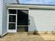 Screened-in porch with siding and view of the lawn with a bird feeder at 1981 Rosedale Ridge Ave, Wake Forest, NC 27587