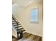 Staircase with wood treads and white risers complemented by a modern railing at 1981 Rosedale Ridge Ave, Wake Forest, NC 27587