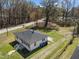 Aerial view of home with a new roof, a large yard, and mature trees at 202 Harper Rd, Hillsborough, NC 27278