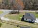 Aerial view of the property showcasing the large yard and surrounding trees at 202 Harper Rd, Hillsborough, NC 27278
