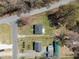 Aerial view of property showcasing the home's layout and its location on a spacious lot at 202 Harper Rd, Hillsborough, NC 27278