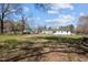 The backyard has plenty of open space, a few sheds, and a charming single story home at 202 Harper Rd, Hillsborough, NC 27278