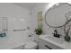 A bathroom featuring an updated vanity, medicine cabinet, bathtub, and updated faucet at 202 Harper Rd, Hillsborough, NC 27278