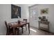 Bright dining area features stylish decor and a door leading outside, enhancing the space at 202 Harper Rd, Hillsborough, NC 27278