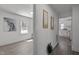 Hallway featuring neutral decor, consistent flooring, and access to various rooms at 202 Harper Rd, Hillsborough, NC 27278