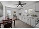 Bright kitchen featuring white cabinets, modern appliances, and dining area at 202 Harper Rd, Hillsborough, NC 27278