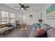 Bright living room with ample seating, a ceiling fan, and natural light at 202 Harper Rd, Hillsborough, NC 27278