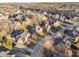 A lovely aerial view of a neighborhood showcasing diverse home styles and mature trees, offering a serene and established community at 2110 Crigan Bluff Dr, Cary, NC 27513