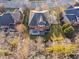 Aerial view of a large home with a well-manicured lawn and private deck, showing the property's spacious backyard at 2110 Crigan Bluff Dr, Cary, NC 27513