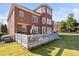 Spacious backyard featuring a deck ideal for outdoor gatherings, lawn, and lovely brick home at 2110 Crigan Bluff Dr, Cary, NC 27513