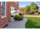 Brick home with a lovely backyard, patio and stairs leading to the back door at 2110 Crigan Bluff Dr, Cary, NC 27513