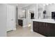 Bright bathroom with dual vanities, sleek fixtures, and a view into the main bedroom at 2110 Crigan Bluff Dr, Cary, NC 27513