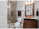 Modern bathroom featuring a glass shower and unique vessel sink with wood vanity at 2110 Crigan Bluff Dr, Cary, NC 27513