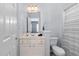 Bathroom features a vanity with marble countertop, a toilet, and a window with white blinds at 2110 Crigan Bluff Dr, Cary, NC 27513
