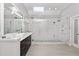 Sleek bathroom featuring a glass shower, modern fixtures, and a spacious marble countertop at 2110 Crigan Bluff Dr, Cary, NC 27513