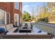 Cozy outdoor deck setting with comfortable seating, and manicured landscaping at 2110 Crigan Bluff Dr, Cary, NC 27513