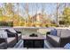 Inviting deck area with cozy seating around a stylish fire pit, perfect for gatherings at 2110 Crigan Bluff Dr, Cary, NC 27513