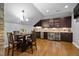 Charming dining area featuring a wet bar with wine fridge and custom cabinetry at 2110 Crigan Bluff Dr, Cary, NC 27513