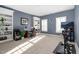 Spacious home office with custom built-ins, a desk area, and a window with white shutters at 2110 Crigan Bluff Dr, Cary, NC 27513
