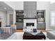 Bright living room with a cozy fireplace, built-in shelving, and plush seating at 2110 Crigan Bluff Dr, Cary, NC 27513