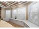Bright living area featuring custom plantation shutters and a cozy window seat at 2110 Crigan Bluff Dr, Cary, NC 27513