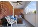 Enclosed brick patio with comfortable seating, lovely flooring, and natural light at 2110 Crigan Bluff Dr, Cary, NC 27513