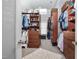 Spacious walk-in closet with custom shelving, storage, and a plush rug at 2110 Crigan Bluff Dr, Cary, NC 27513
