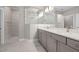 Modern bathroom with double vanity, neutral color scheme and a glass-enclosed shower at 2321 Calluna Ct, Fuquay Varina, NC 27526