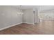 Open dining room with hardwood floors and a modern chandelier at 2321 Calluna Ct, Fuquay Varina, NC 27526