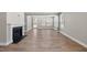 Spacious living room with a fireplace, light gray walls and multiple windows at 2321 Calluna Ct, Fuquay Varina, NC 27526