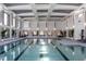 Large community indoor pool features large windows, seating, and a bright design at 2321 Calluna Ct, Fuquay Varina, NC 27526