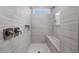 Modern walk-in shower with gray tile surround, bench and brushed nickel hardware at 2321 Calluna Ct, Fuquay Varina, NC 27526